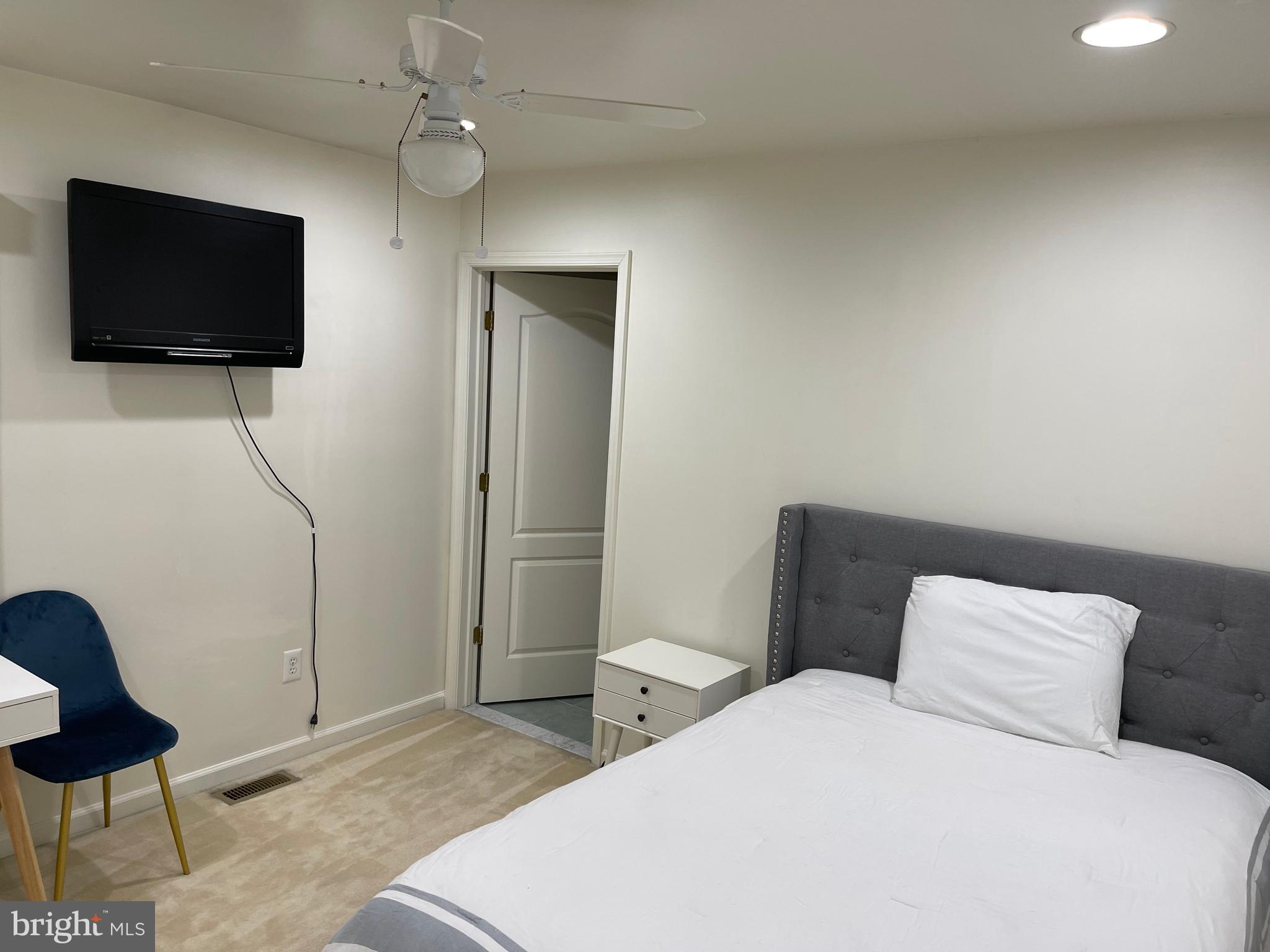 18 Jewel Road Princeton Junction, NJ 08550 - Photo 45 of 66 a bedroom with a bed and a flat screen tv
