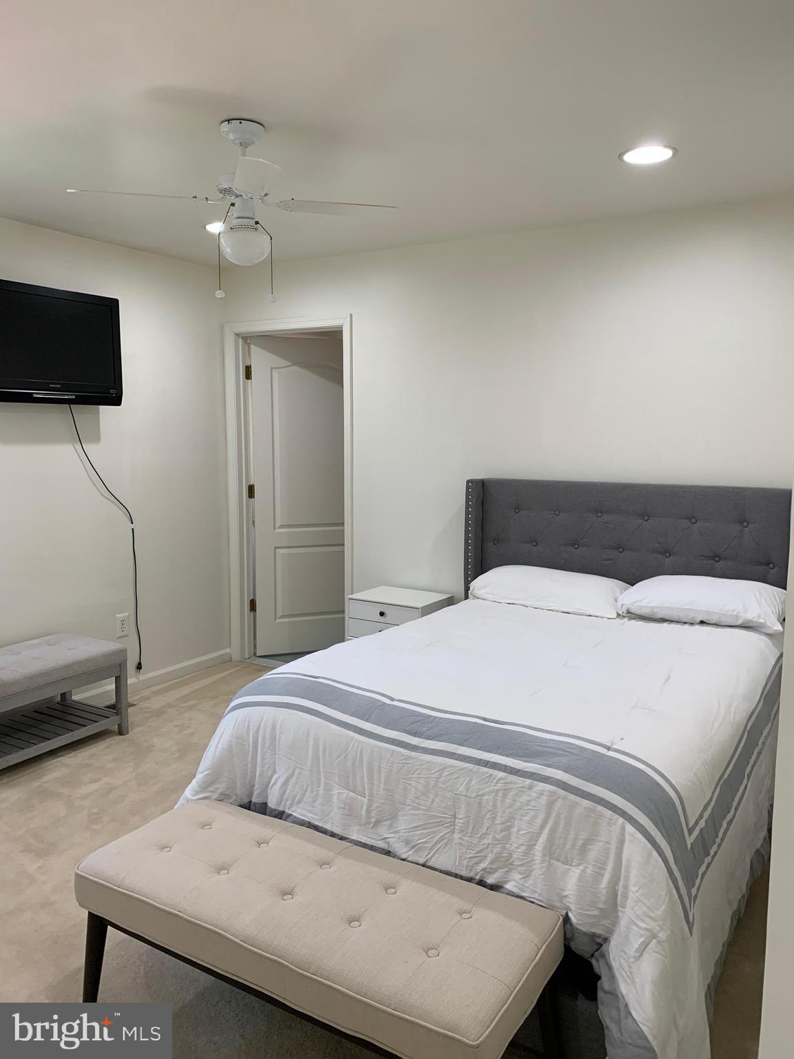 18 Jewel Road Princeton Junction, NJ 08550 - Photo 46 of 66 a bedroom with a bed and a flat screen tv