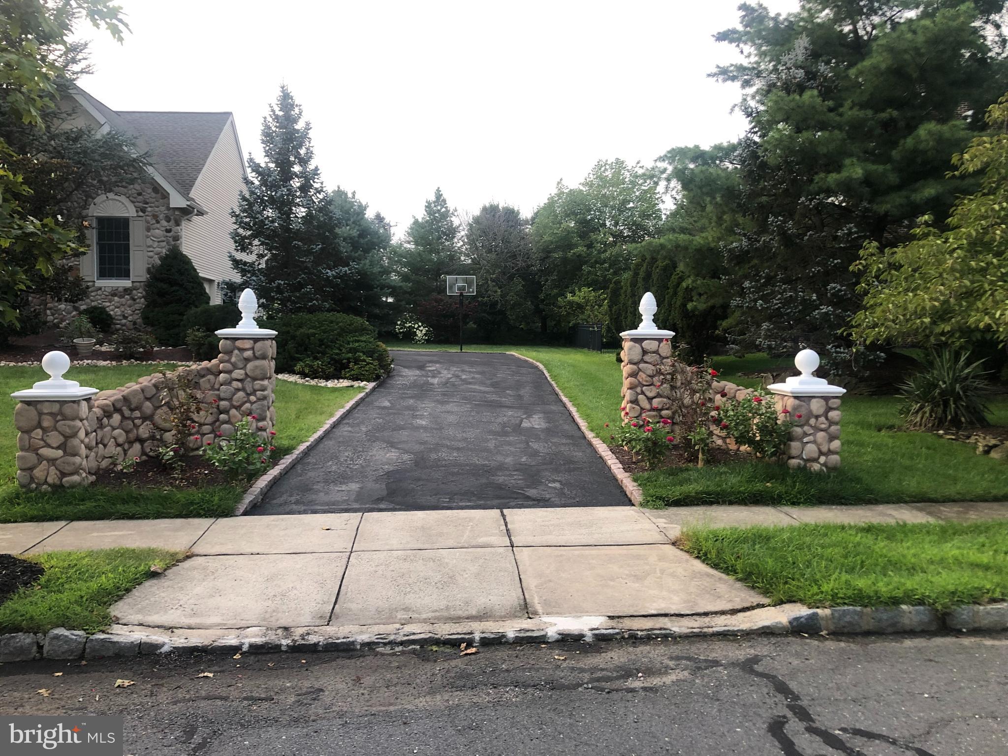 18 Jewel Road Princeton Junction, NJ 08550 - Photo 65 of 66 a white house with a yard and plants