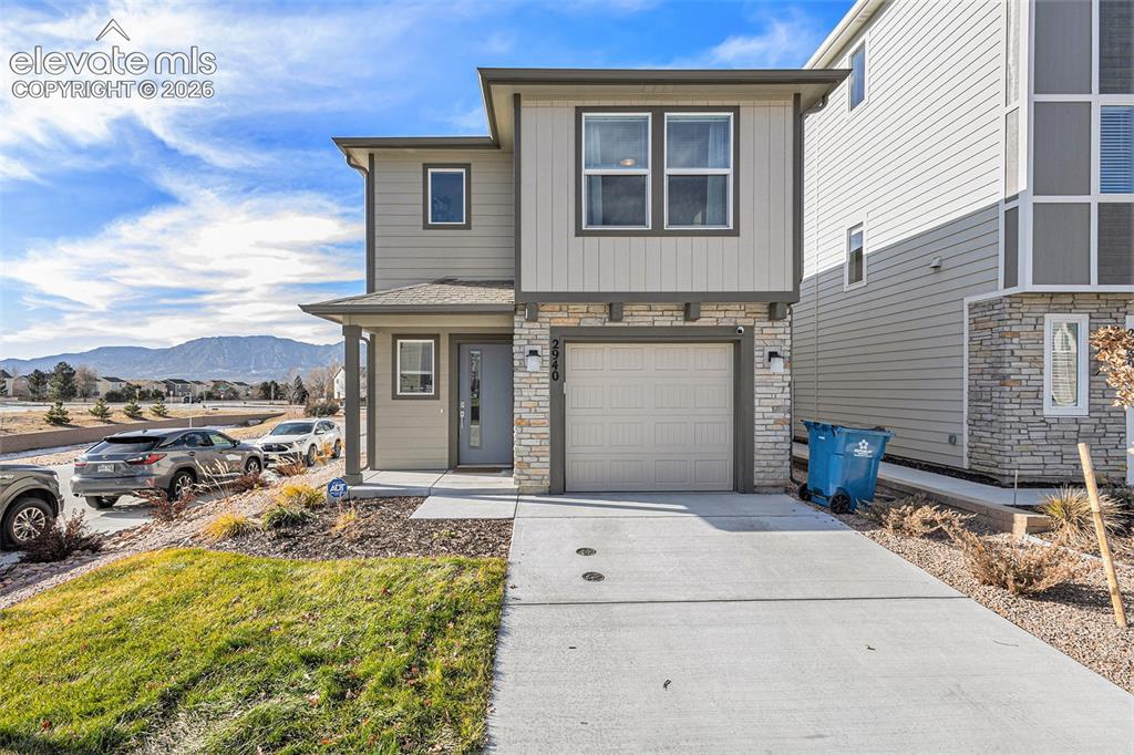 2940 Magic Carpet Loop Colorado Springs, CO 80916 - Photo 2 of 21 a view of a house with backyard
