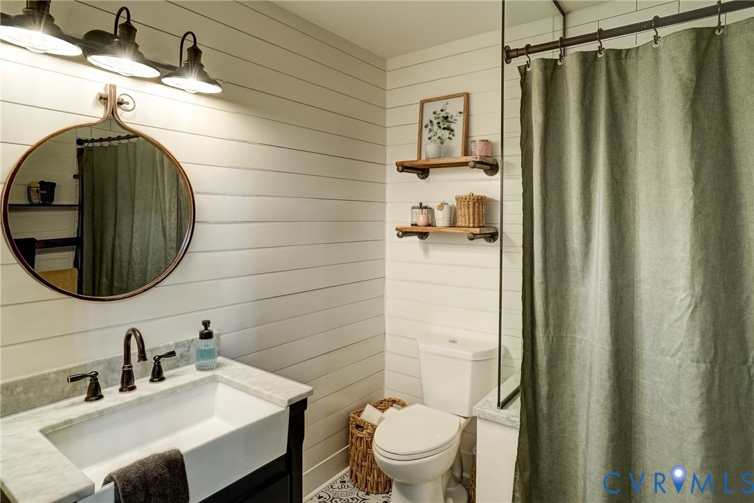 1174 Dorset Road Powhatan, VA 23139 - Photo 15 of 38 Bathroom featuring white shiplap walls and pattern