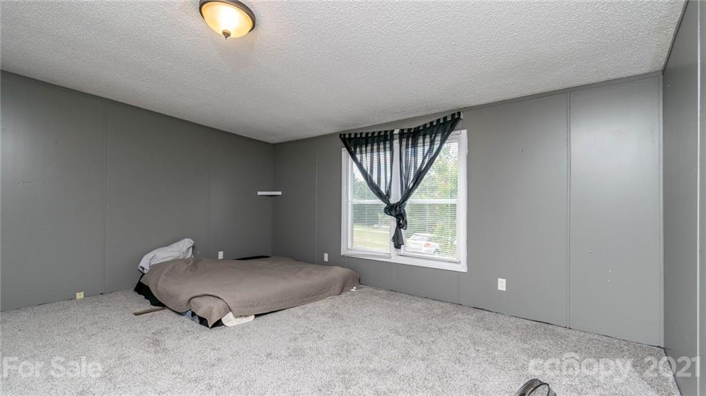 449 Divide Loop Flat Rock, NC 28731 - Photo 16 of 36 an empty room with windows