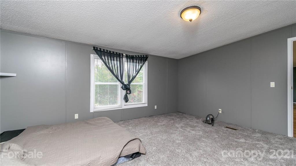 449 Divide Loop Flat Rock, NC 28731 - Photo 18 of 36 an empty room with a window