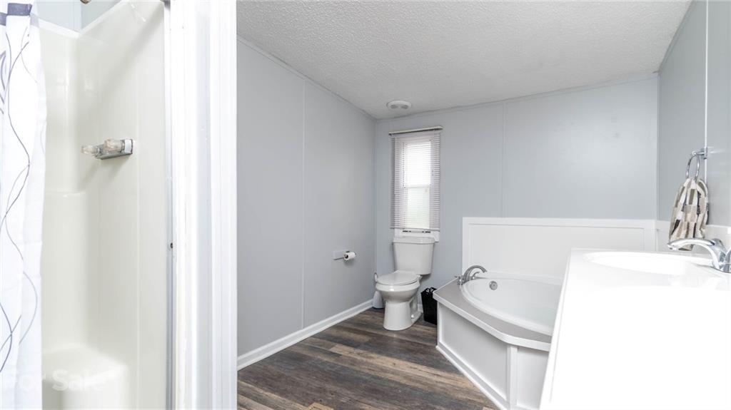 449 Divide Loop Flat Rock, NC 28731 - Photo 19 of 36 a bathroom with a sink and a toilet