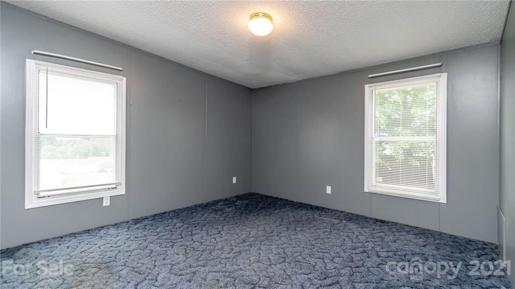 449 Divide Loop Flat Rock, NC 28731 - Photo 20 of 36 an empty room with a window