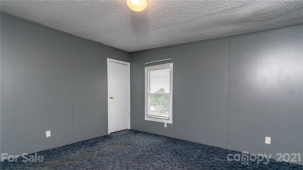 449 Divide Loop Flat Rock, NC 28731 - Photo 21 of 36 a view of an empty room with a window