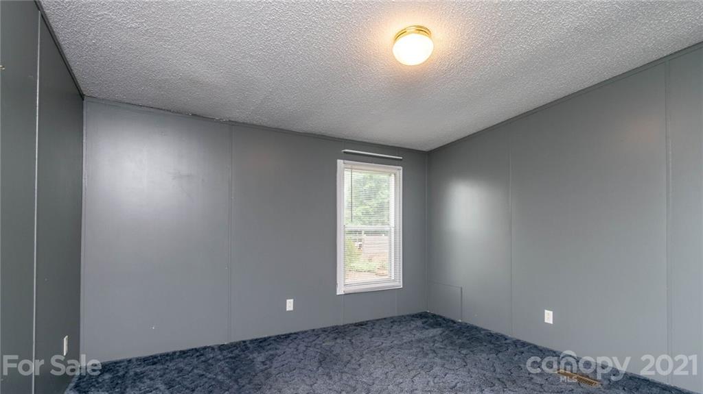 449 Divide Loop Flat Rock, NC 28731 - Photo 23 of 36 an empty room with a empty space and windows