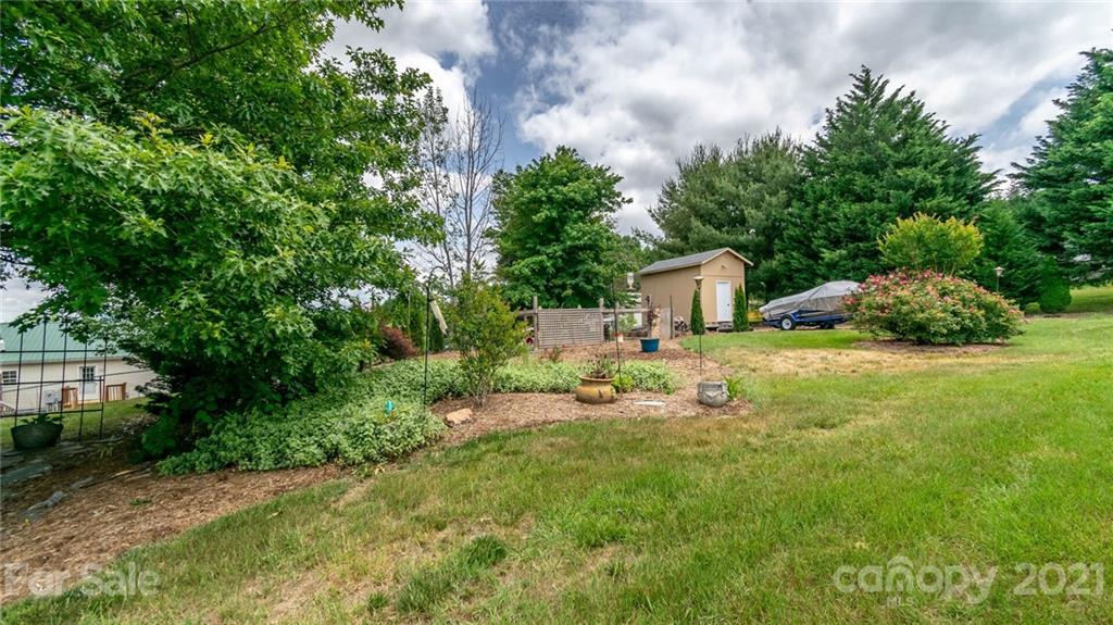 449 Divide Loop Flat Rock, NC 28731 - Photo 34 of 36 a house view with a garden