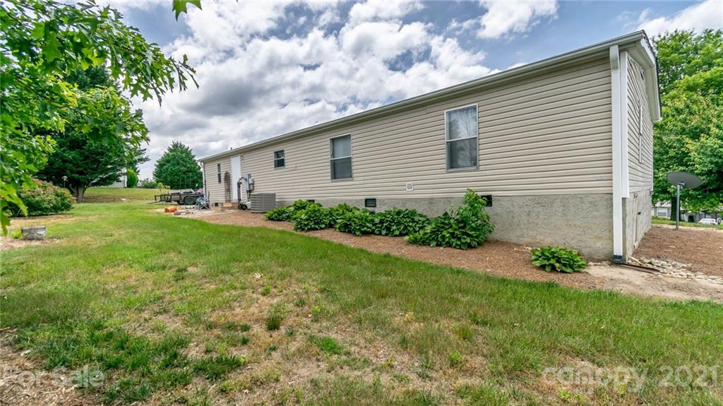 449 Divide Loop Flat Rock, NC 28731 - Photo 36 of 36 a backyard of a house with table and chairs