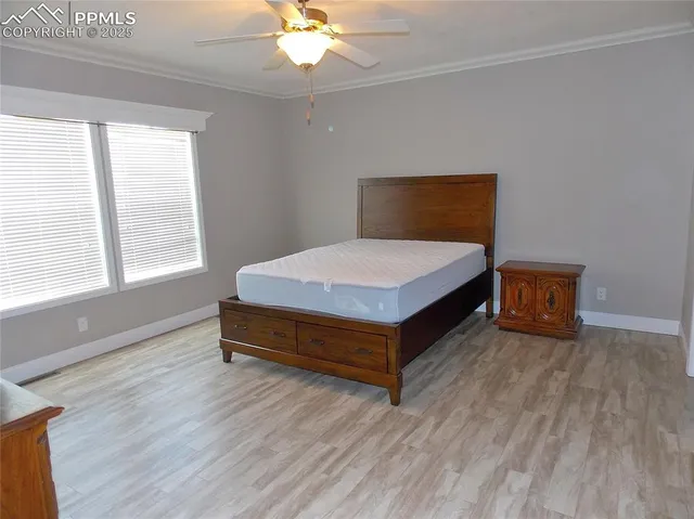 a bathroom with a granite countertop sink a mirror and a shower