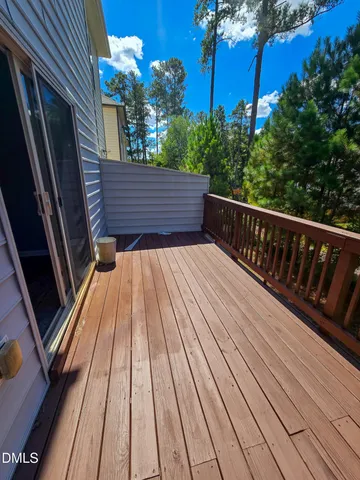 a view of balcony with wooden floor and outdoor space