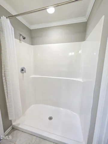 a view of room with a ceiling fan and window