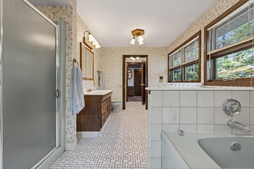 38 Gaudette Street Fall River, MA 02721 - Photo 34 of 41 a bathroom with a sink a mirror and a bathtub