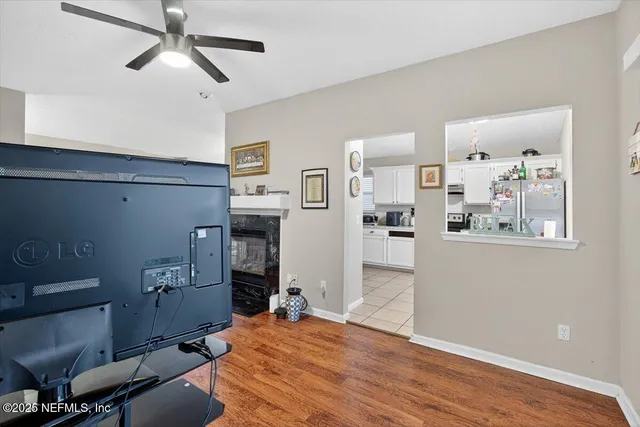 a room with furniture and ceiling fan