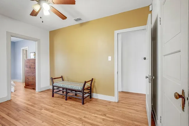 a view of a house with backyard porch and sitting area