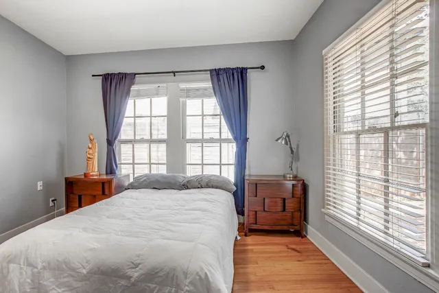 a backyard of a house with a table and chair