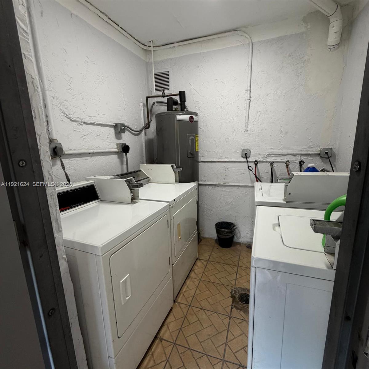 5501 Northwest 7th Street, Unit E301 Miami, FL 33126 - Photo 21 of 28 a utility room with dryer and washer