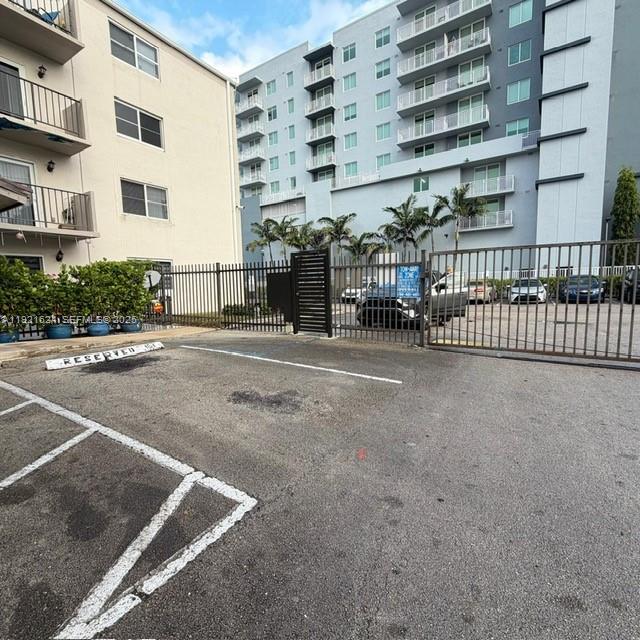 5501 Northwest 7th Street, Unit E301 Miami, FL 33126 - Photo 28 of 28 a view of street with glass door
