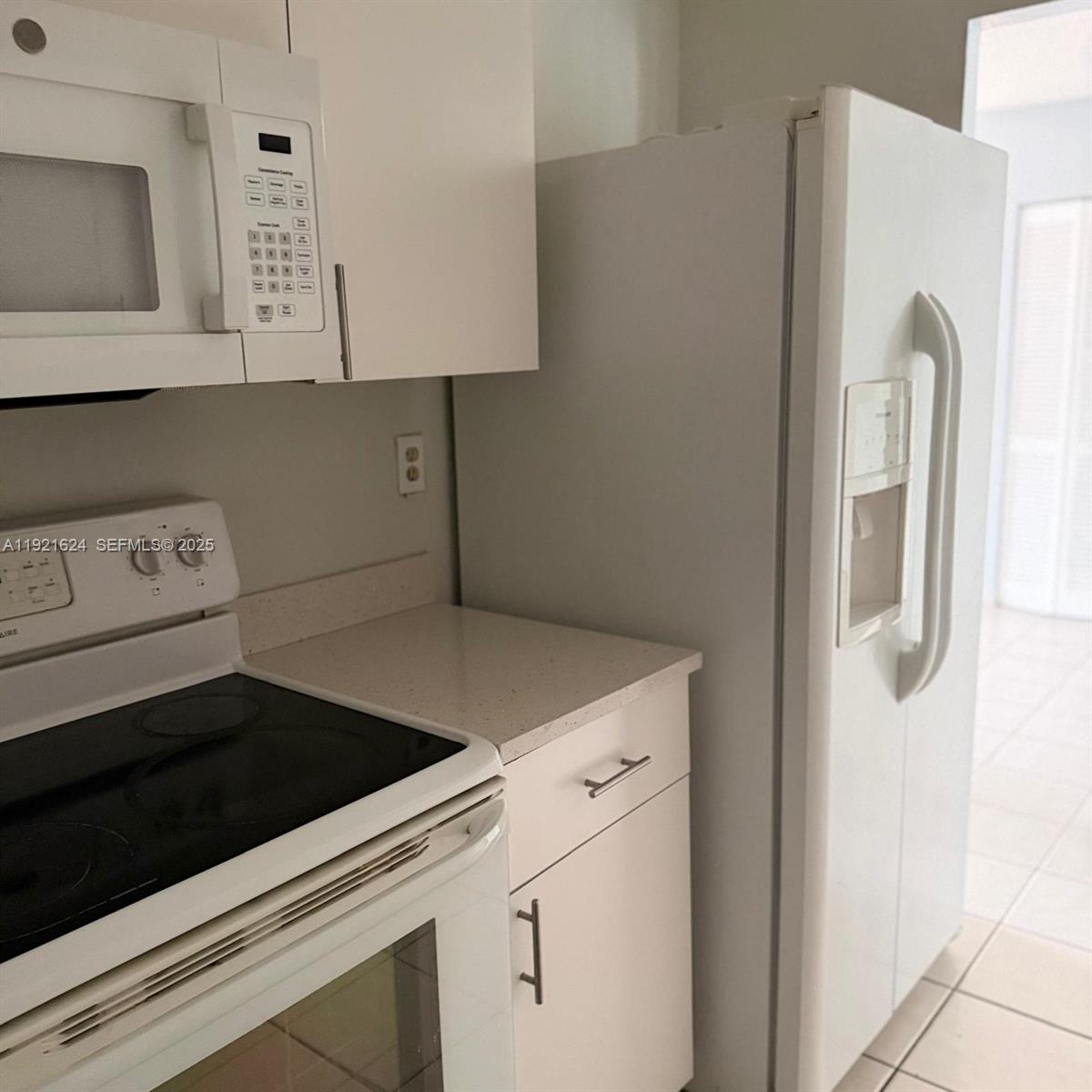 5501 Northwest 7th Street, Unit E301 Miami, FL 33126 - Photo 8 of 28 a utility room with dryer and washer