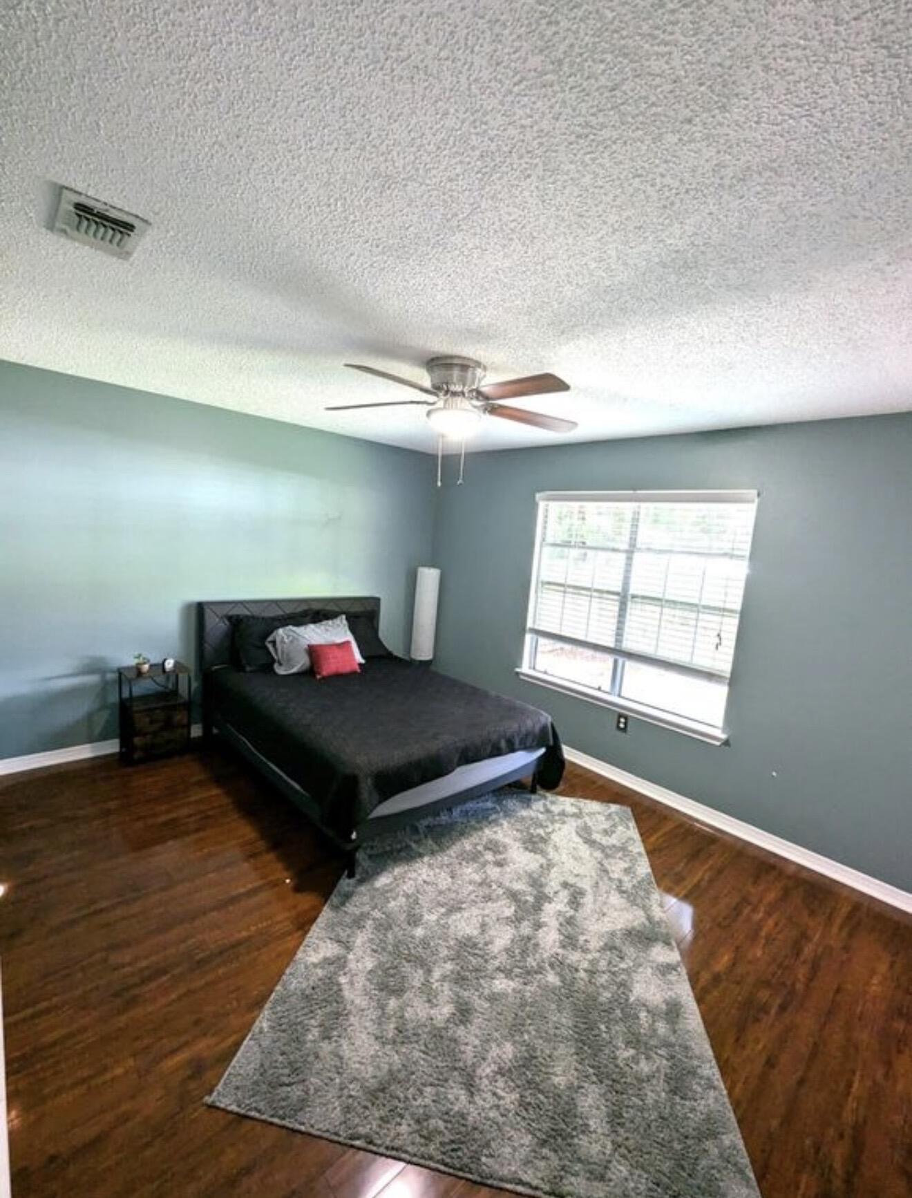 431 Sandy Ridge Circle Mary Esther, FL 32569 - Photo 11 of 16 a bedroom with a bed and a window