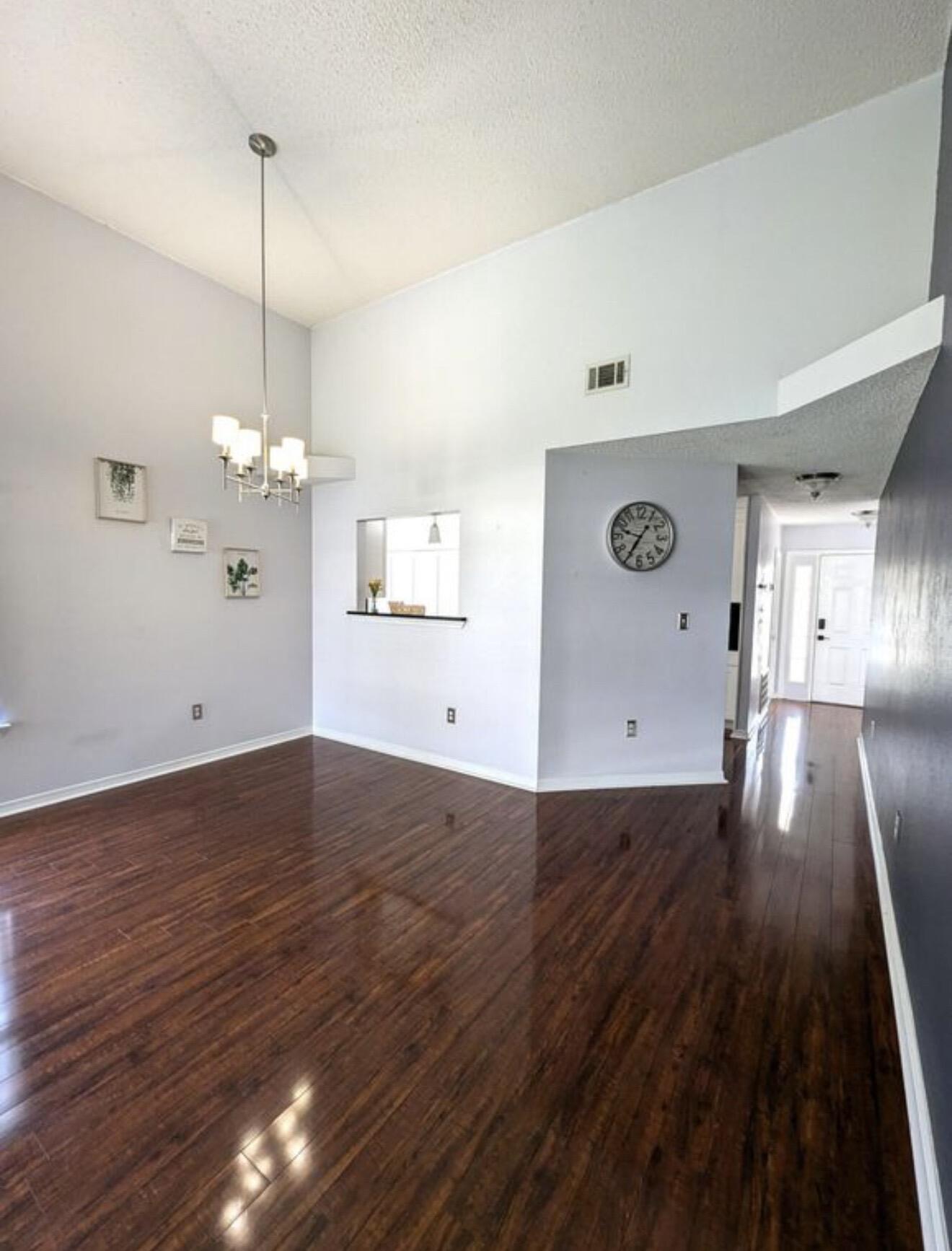431 Sandy Ridge Circle Mary Esther, FL 32569 - Photo 12 of 16 a view of a room with wooden floor and ceiling fan