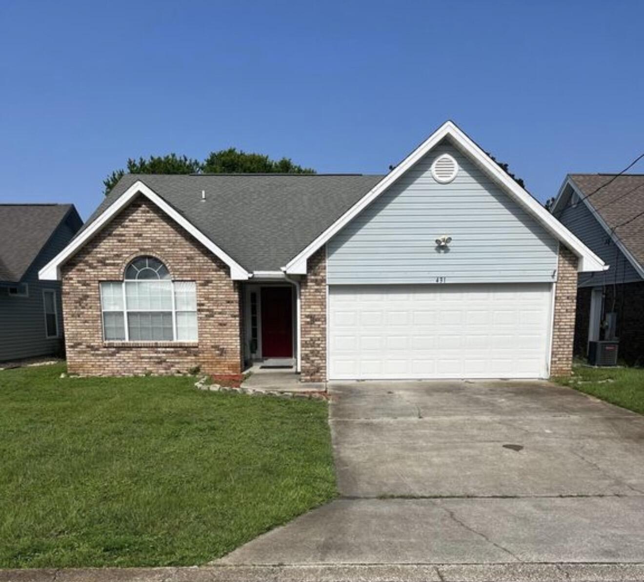 431 Sandy Ridge Circle Mary Esther, FL 32569 - Photo 15 of 16 a front view of a house with a yard and garage