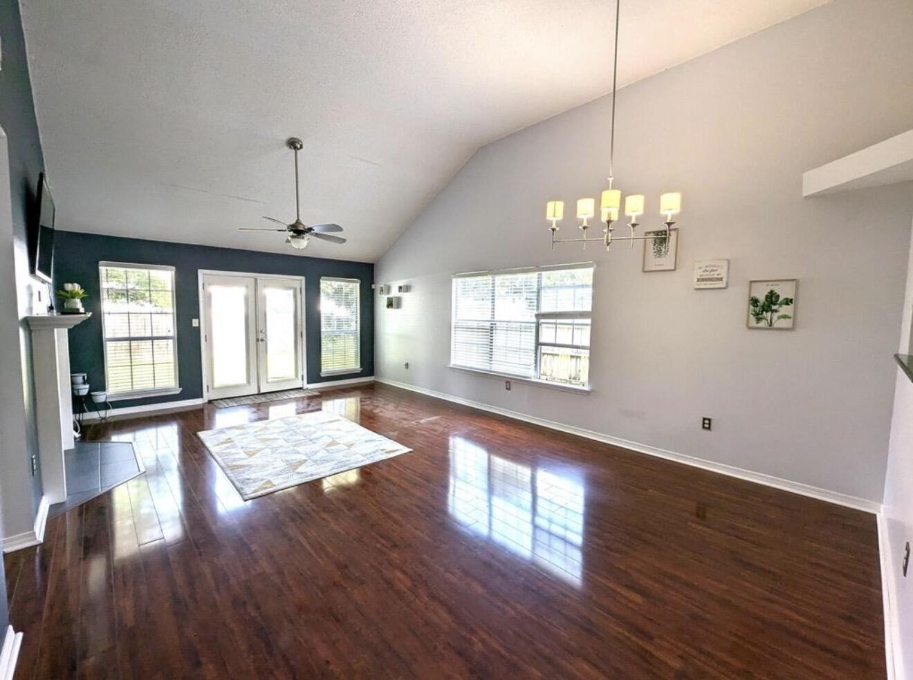 431 Sandy Ridge Circle Mary Esther, FL 32569 - Photo 2 of 16 a view of an empty room with wooden floor and a window