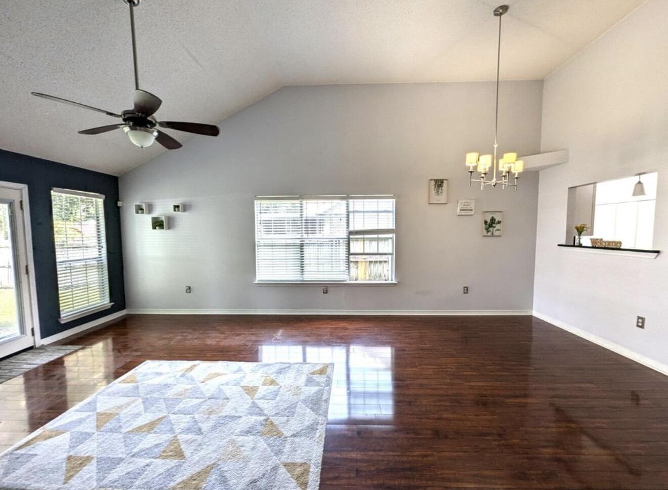 431 Sandy Ridge Circle Mary Esther, FL 32569 - Photo 3 of 16 a view of an empty room with wooden floor and a window