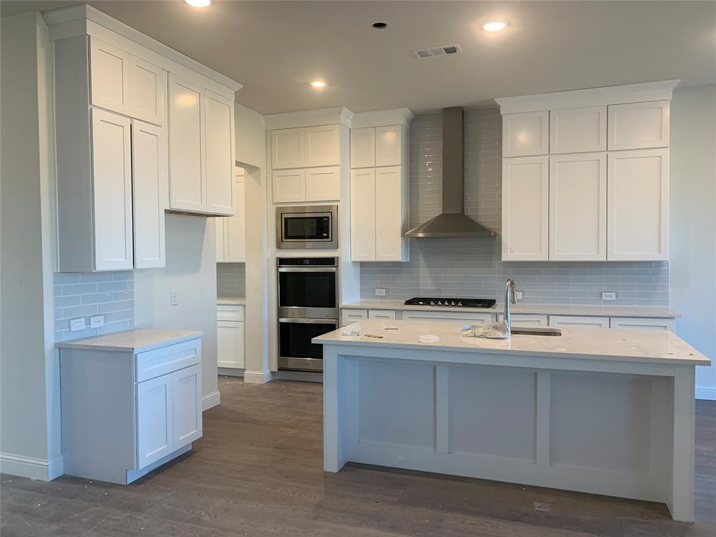 216 Lk Frst Trail Anna, TX 75409 - Photo 3 of 9 a kitchen with stainless steel appliances granite countertop a sink stove and refrigerator