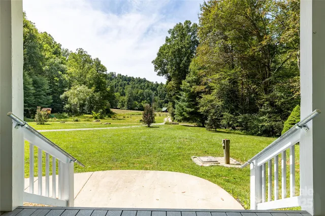 a view of a backyard with swimming pool