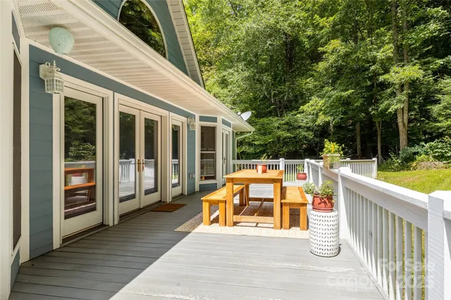 a view of deck with chairs and wooden floor