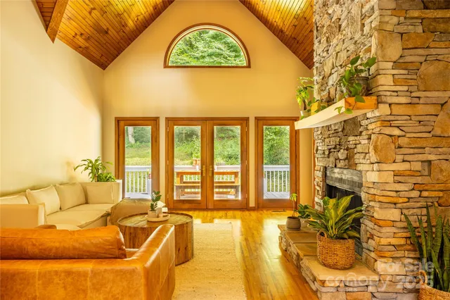 a living room with a couch and chandelier