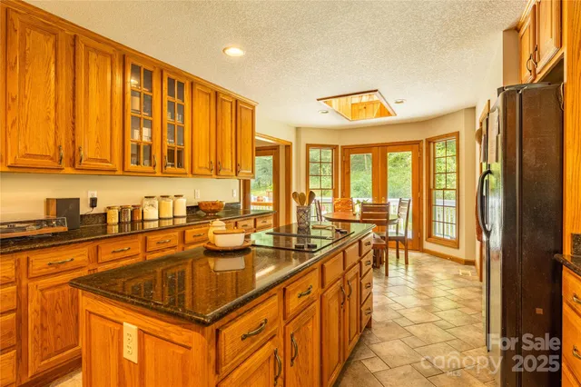 a very nice looking kitchen with a large window