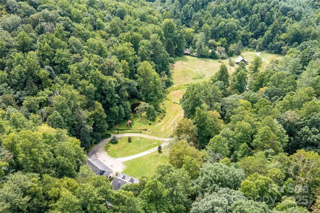 a view of a swimming pool with a yard