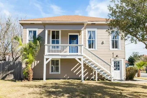 a flat screen tv sitting on top of a wooden floor