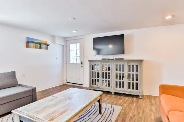 a living room with furniture and a rug