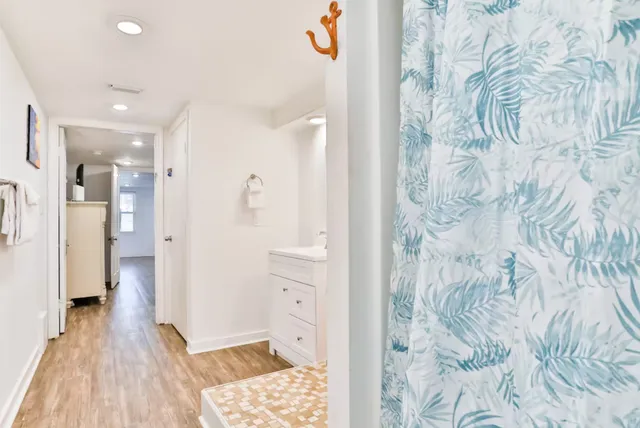 a bathroom with a bathtub and a shower