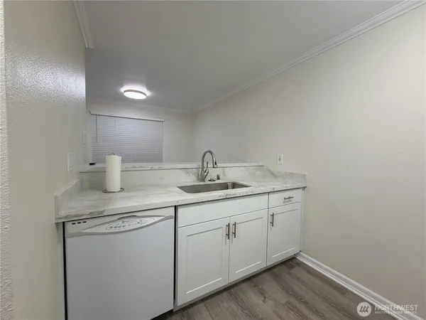a utility room with a sink dryer and washer