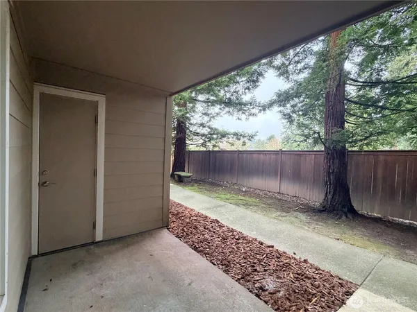 a view of small space with wooden fence