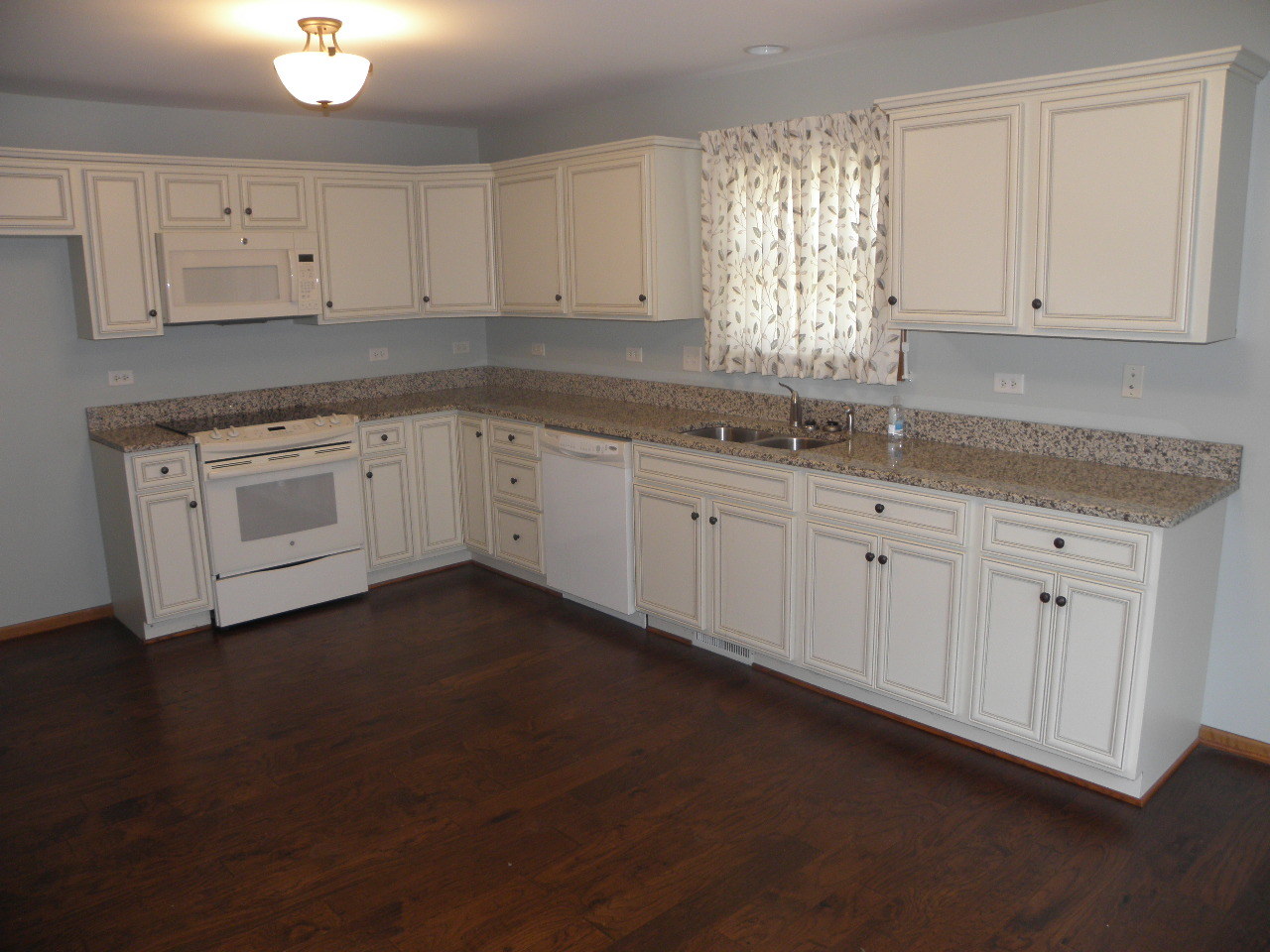 1793 Red Willow Road Morris, IL 60450 - Photo 10 of 22 a kitchen with granite countertop white cabinets white appliances and a granite counter tops
