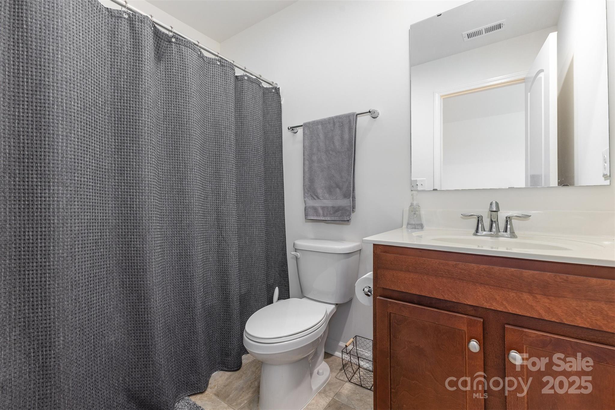 26043 Appleyard Court Lancaster, SC 29720 - Photo 15 of 23 a bathroom with a sink a toilet and shower
