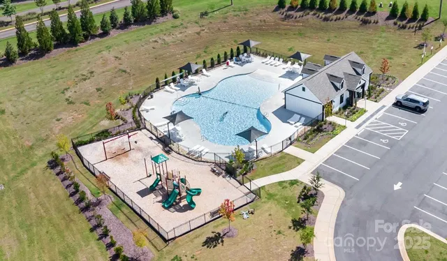 an aerial view of a house with outdoor space