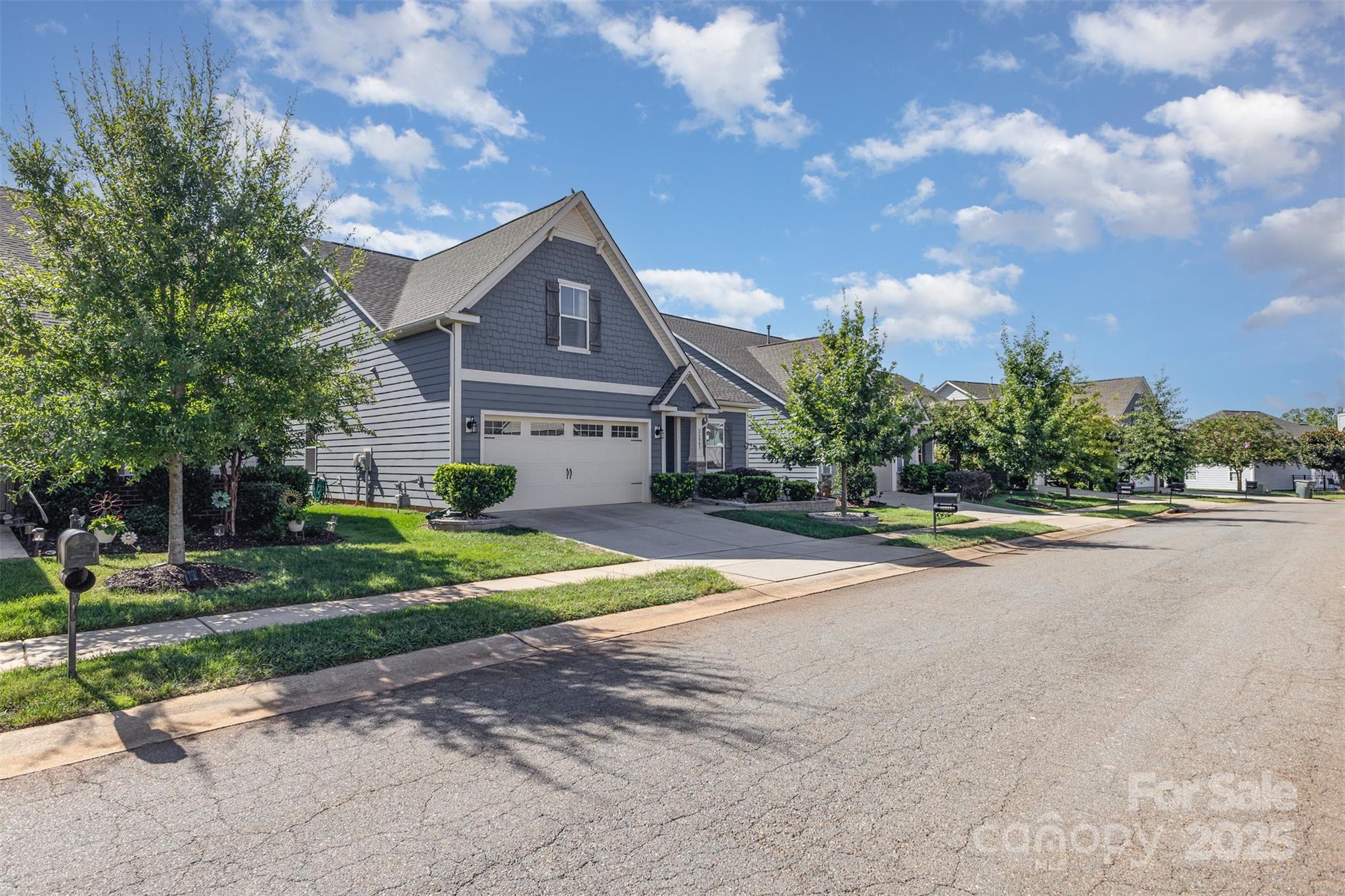 26043 Appleyard Court Lancaster, SC 29720 - Photo 2 of 23 a front view of a house with a yard and garage