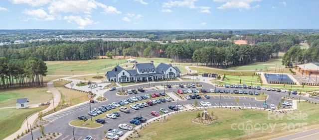 swimming pool view with a lake view