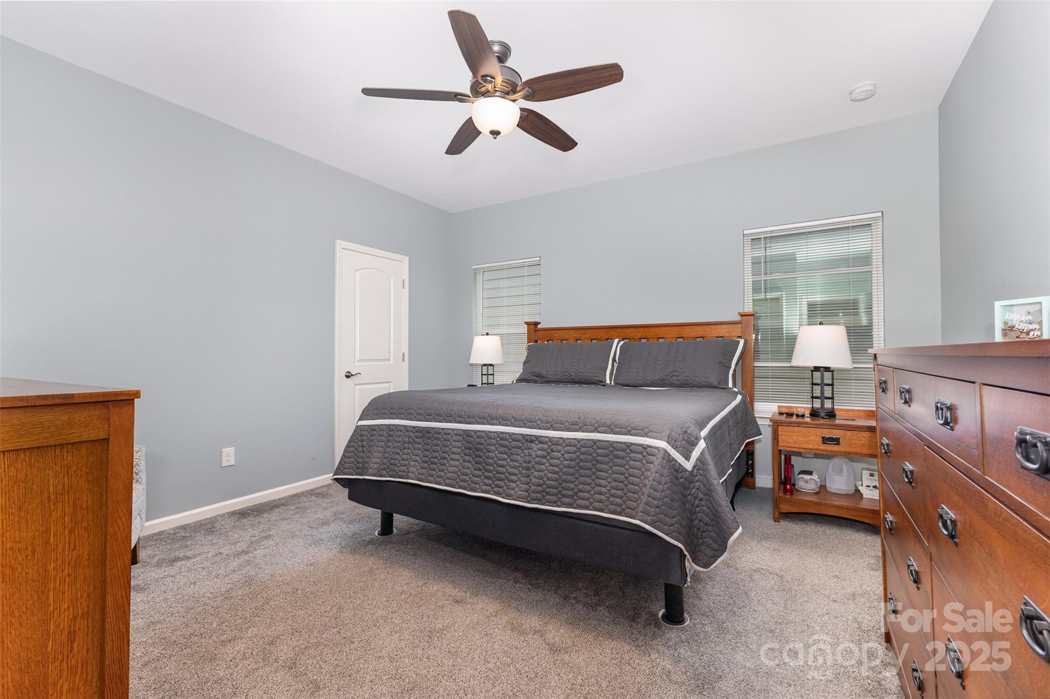 26043 Appleyard Court Lancaster, SC 29720 - Photo 10 of 23 a bedroom with a bed and a chandelier