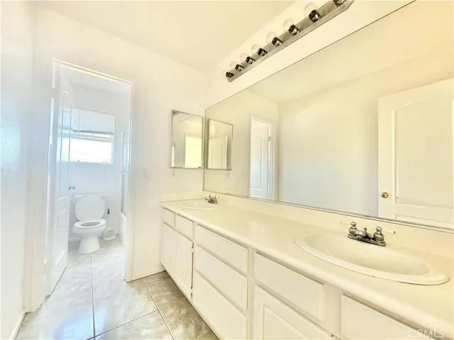 a view of a hallway with washer and dryer