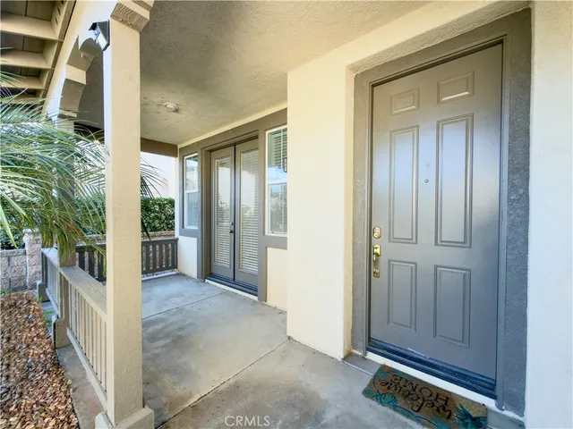 a view of an entryway with wooden floor and door