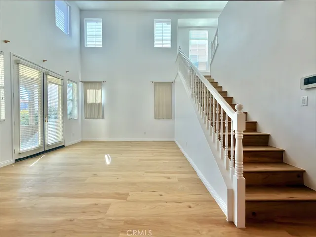 a view of an entryway with wooden floor and door