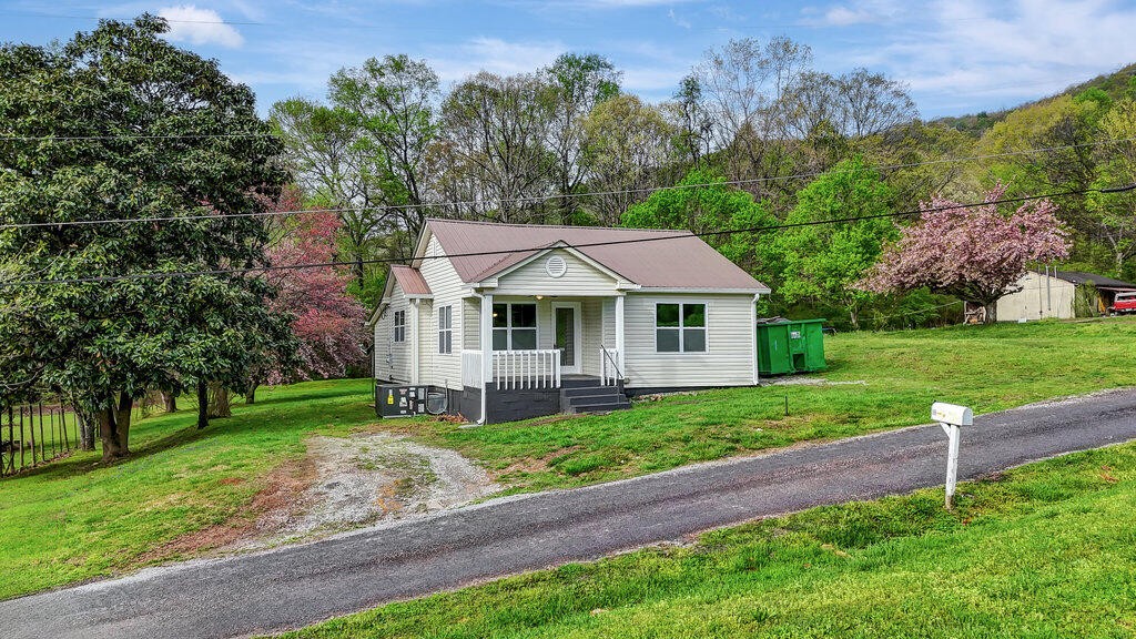 183 Earl Ezell Road Spring City, TN 37381 - Photo 1 of 30 a front view of a house with a yard