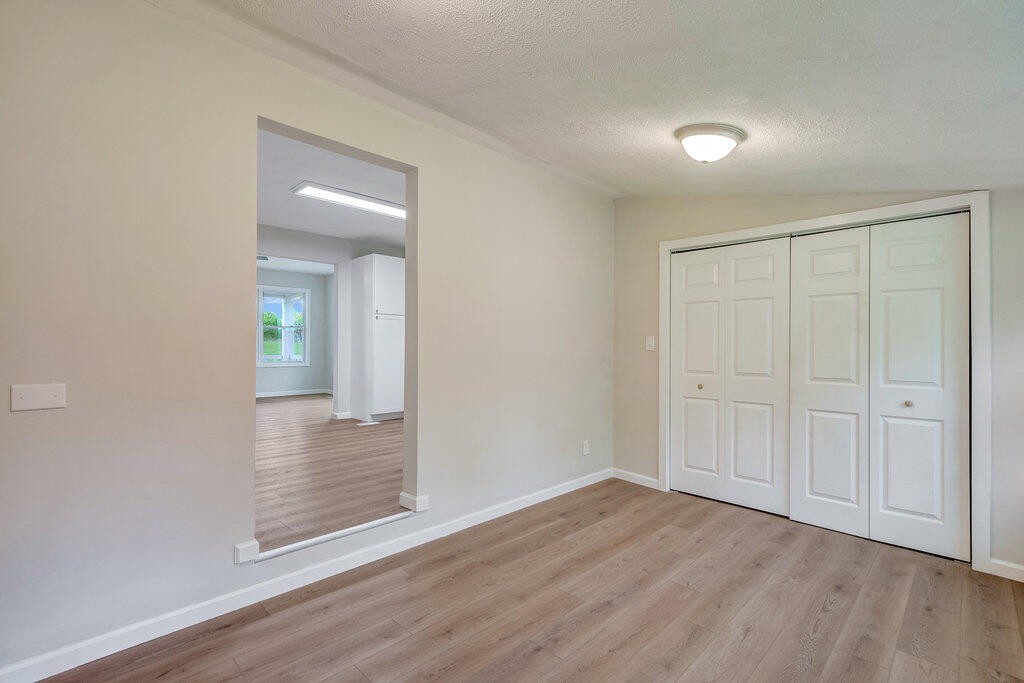 183 Earl Ezell Road Spring City, TN 37381 - Photo 11 of 30 wooden floor in an empty room